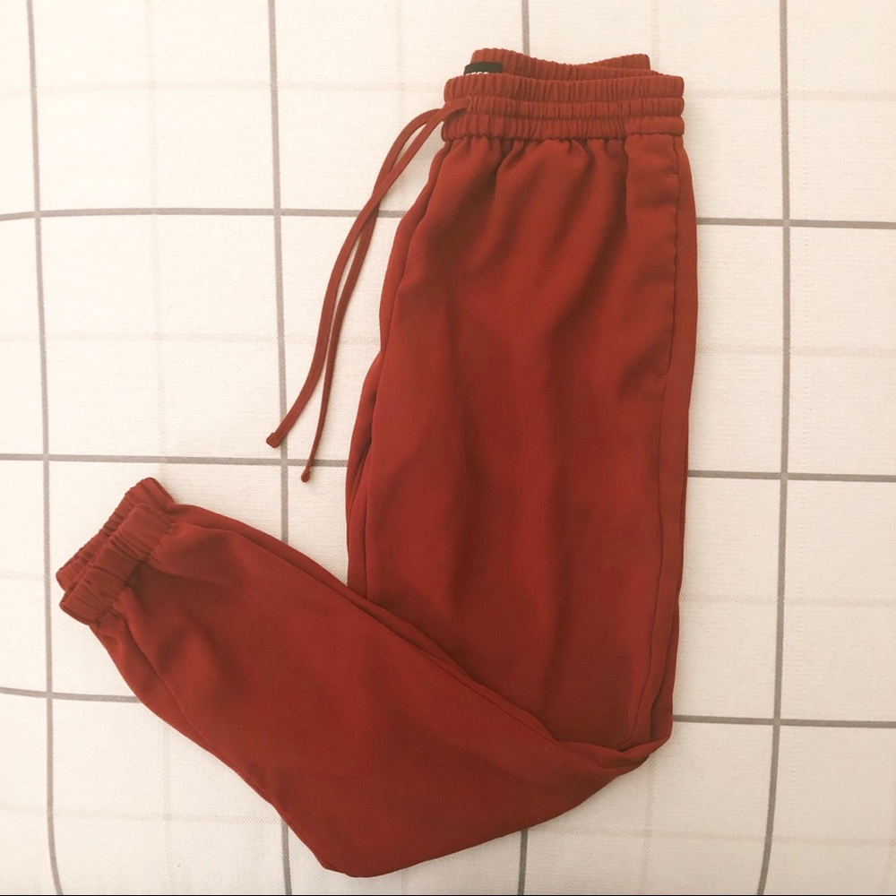 Express burnt orange joggers. Size xxs